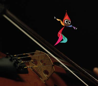 Close-up of a violin bridge and strings with a colorful, abstract character playing a flute in the background.